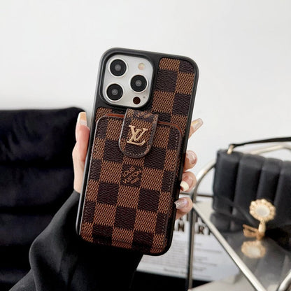 A hand holding a brown iPhone case with a monogram design and a card slot on the back.